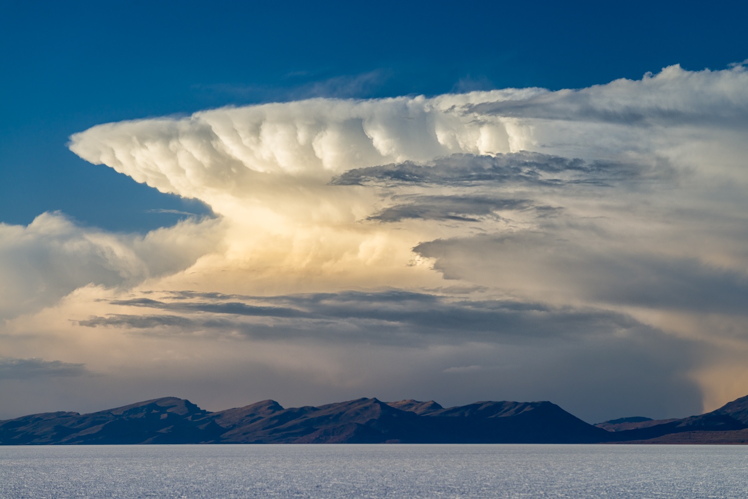 Thunderhead cloud over the Salar de Uyuni salt flats, Bolivia.