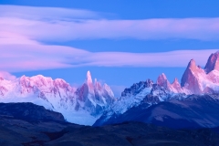 Lenticular clouds at dawn over Mt. Fitzroy and Cerro Torre, Argentina.